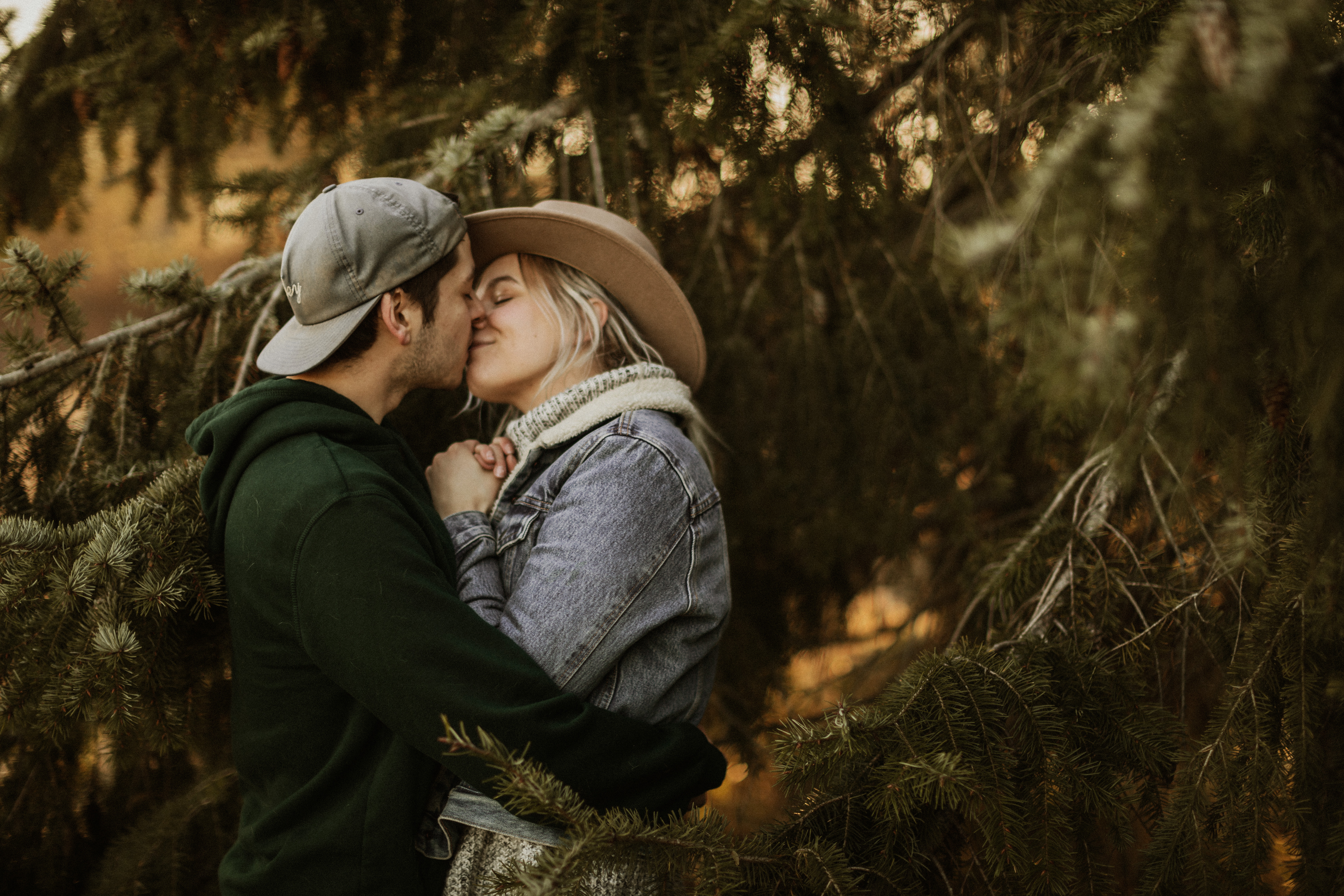 couple kissing in the woods