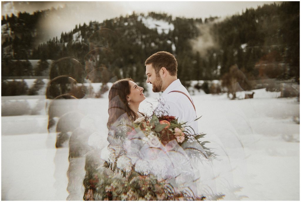 bride and groom hugging in front of mountain