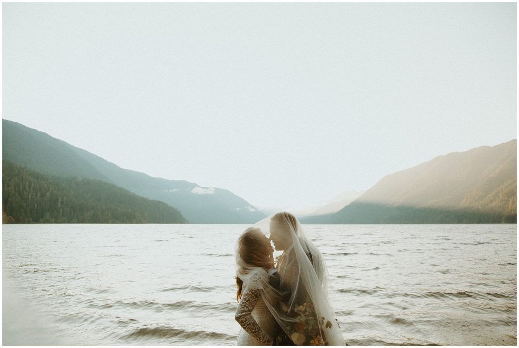 bride and groom in lake