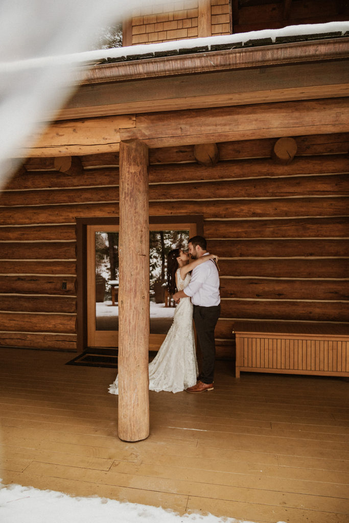 Couple embracing each other in snow lodge