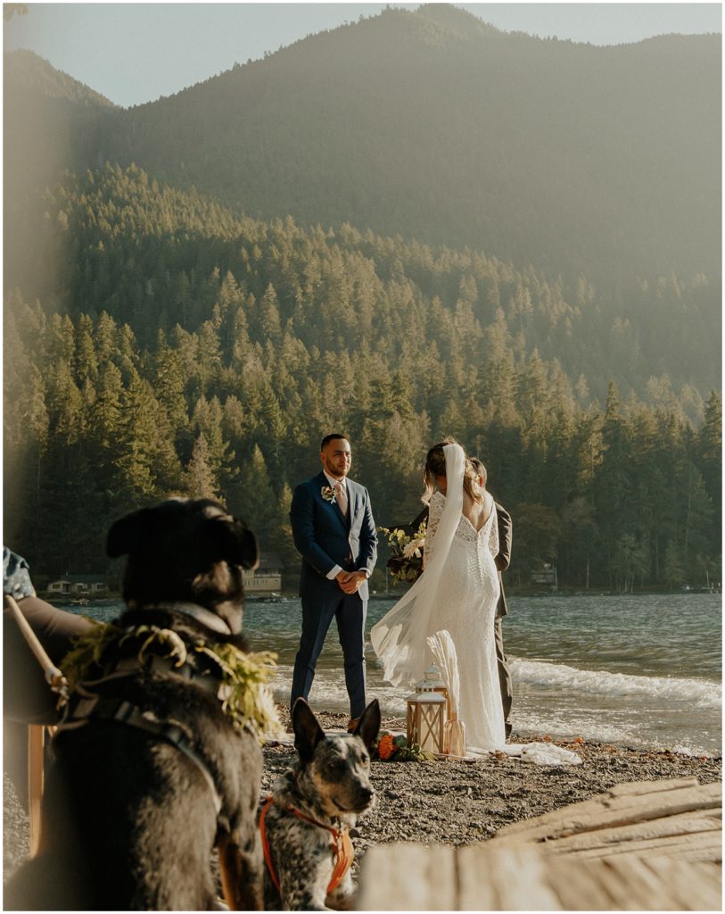 Couple elopement ceremony in front of lake