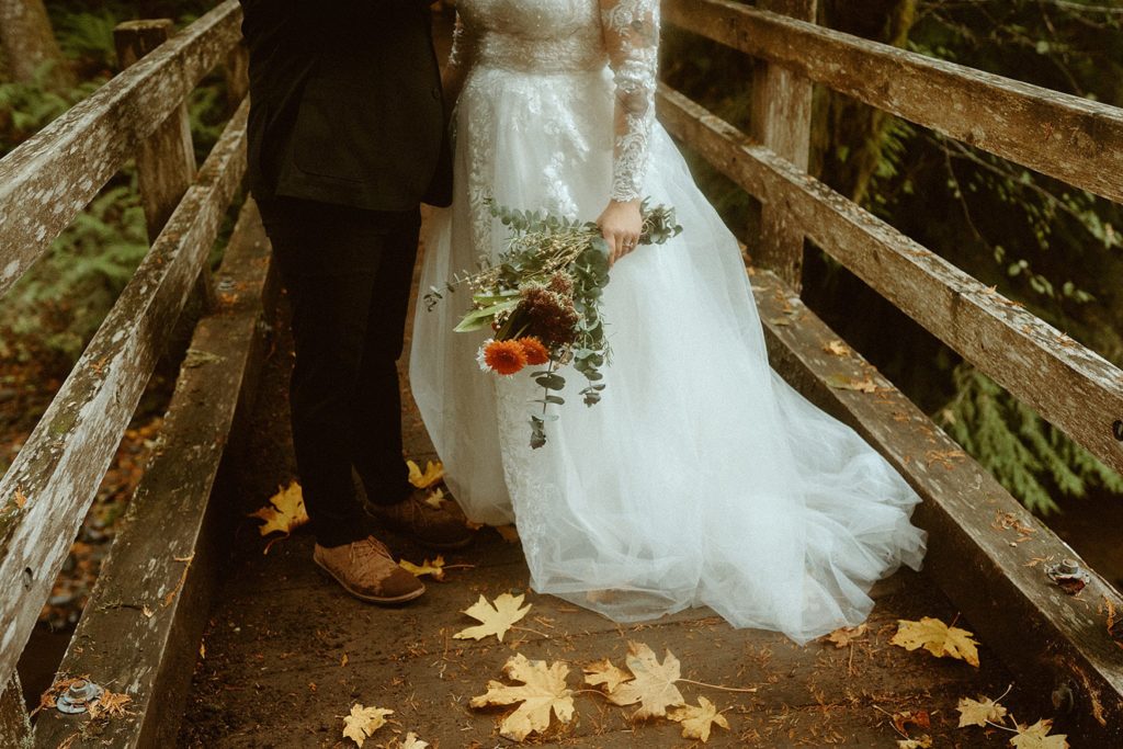 couple in autumn at the lake crescent lodge trails