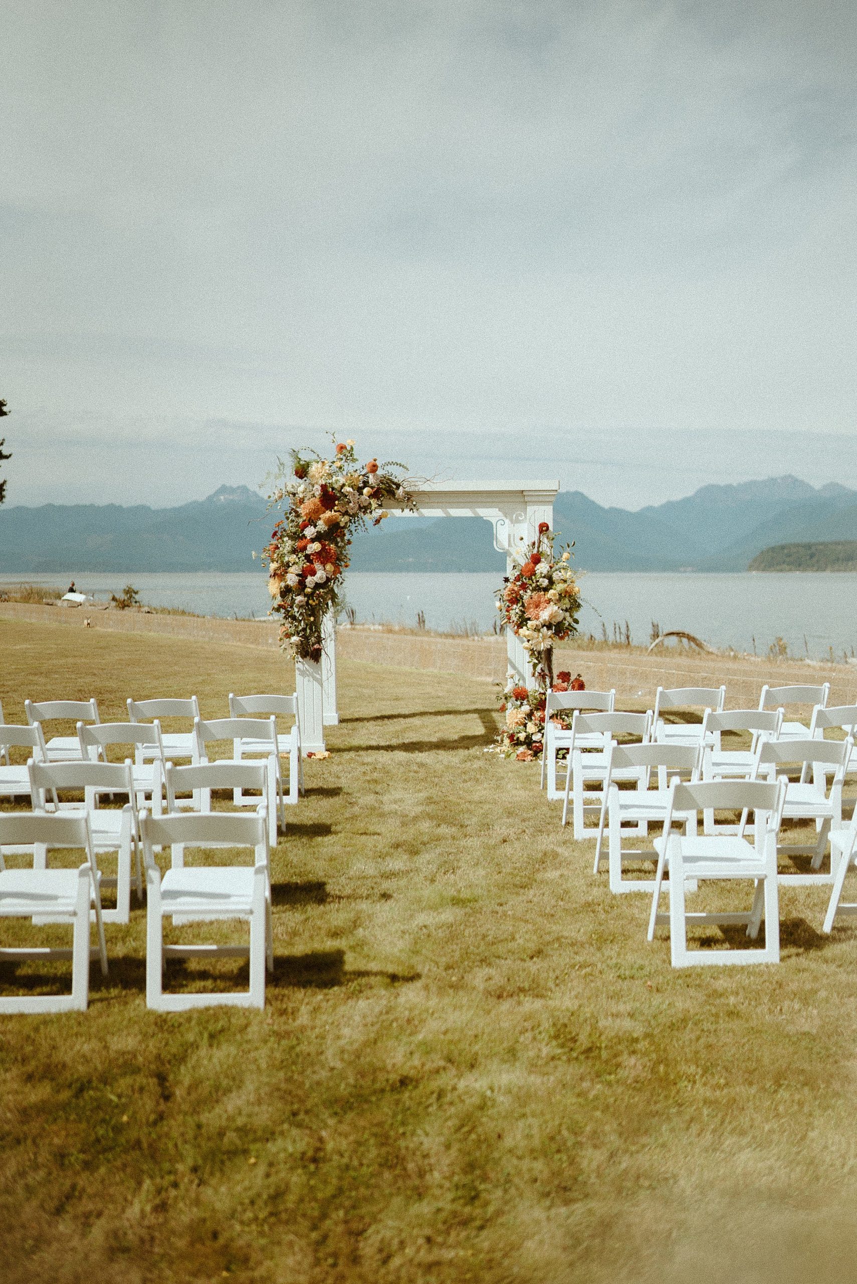 wedding arch and chairs overlooking landscape 