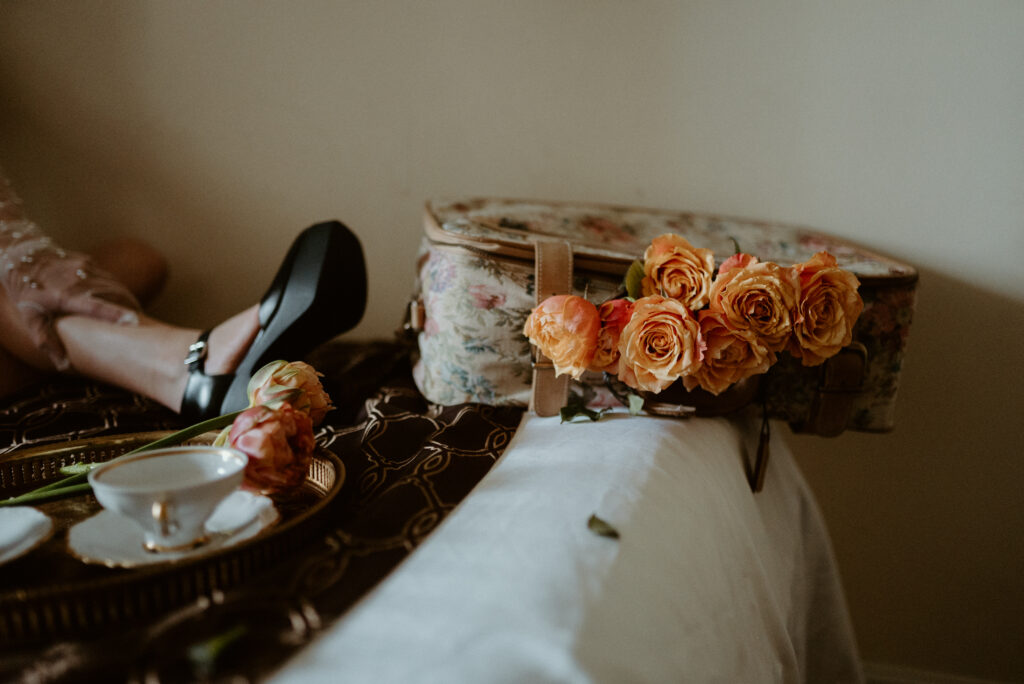 roses and tulips in suitcase 