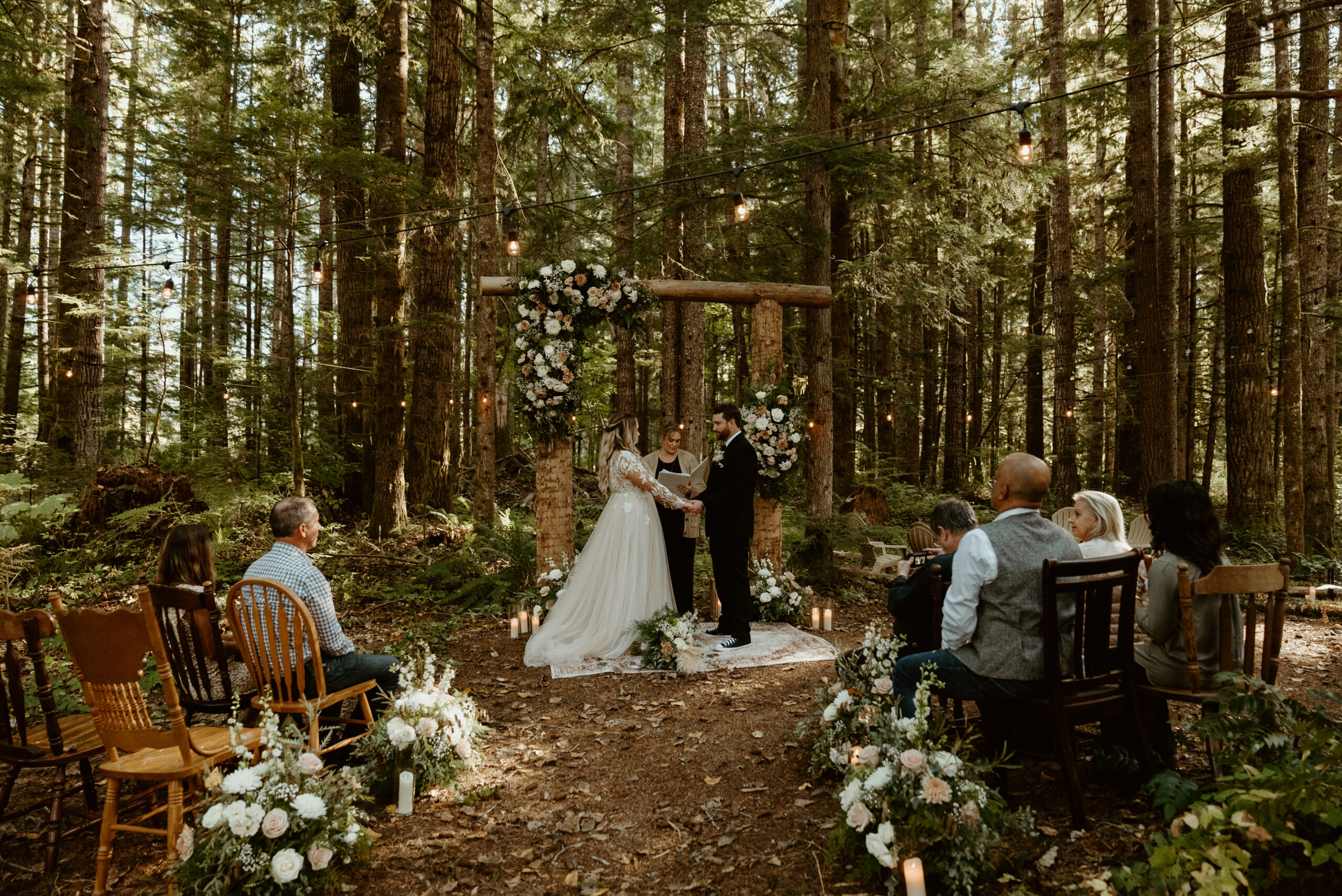 mt. rainier elopement in the backyard of a local airbnb bride and groom at the altar