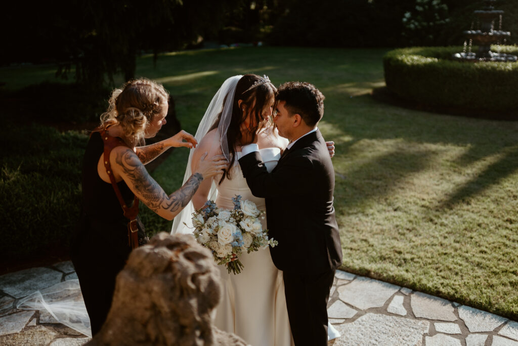 PNW photographer Makenzy Smith of Northwest Focus Co. working with her couple during their wedding and posing them.