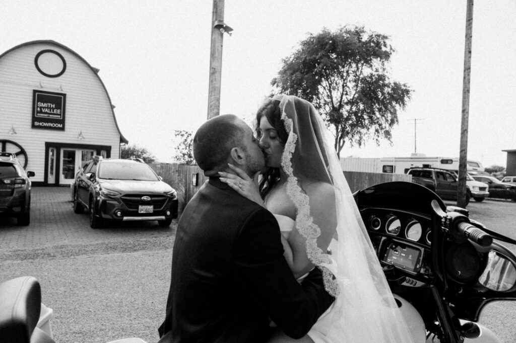 kissing wedding couple in front of airbnb in Bow, washington