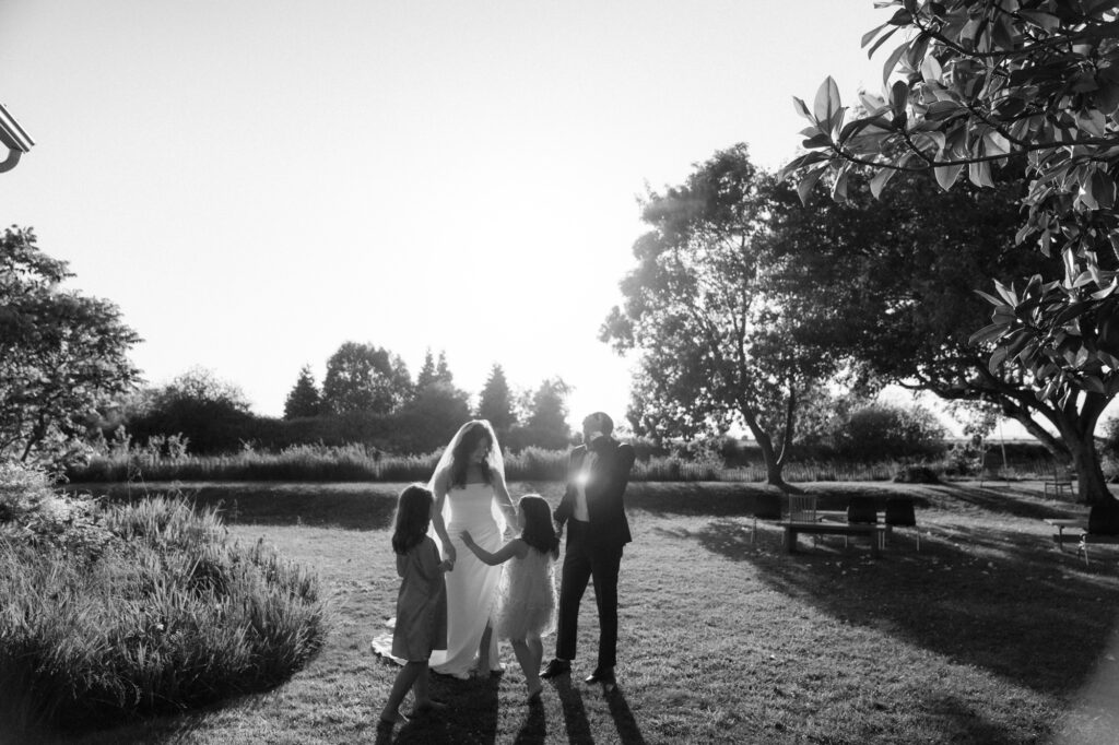 Bride dancing with family at small wedding