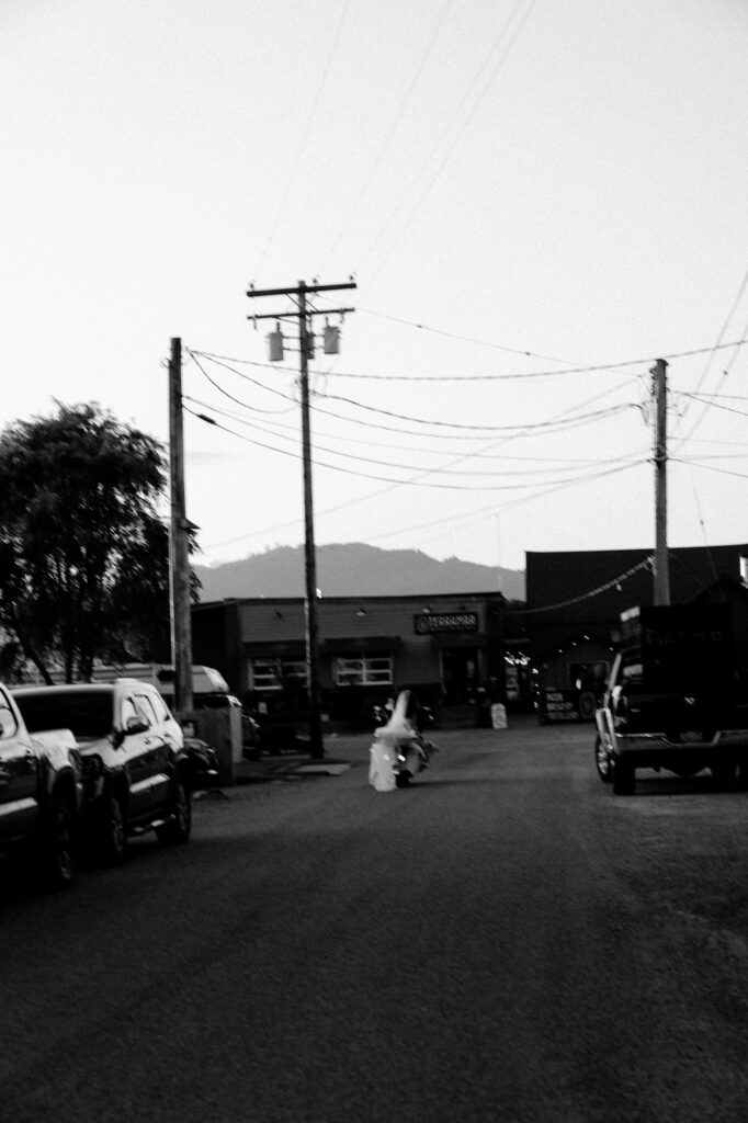 couple riding away from wedding on harley davidson