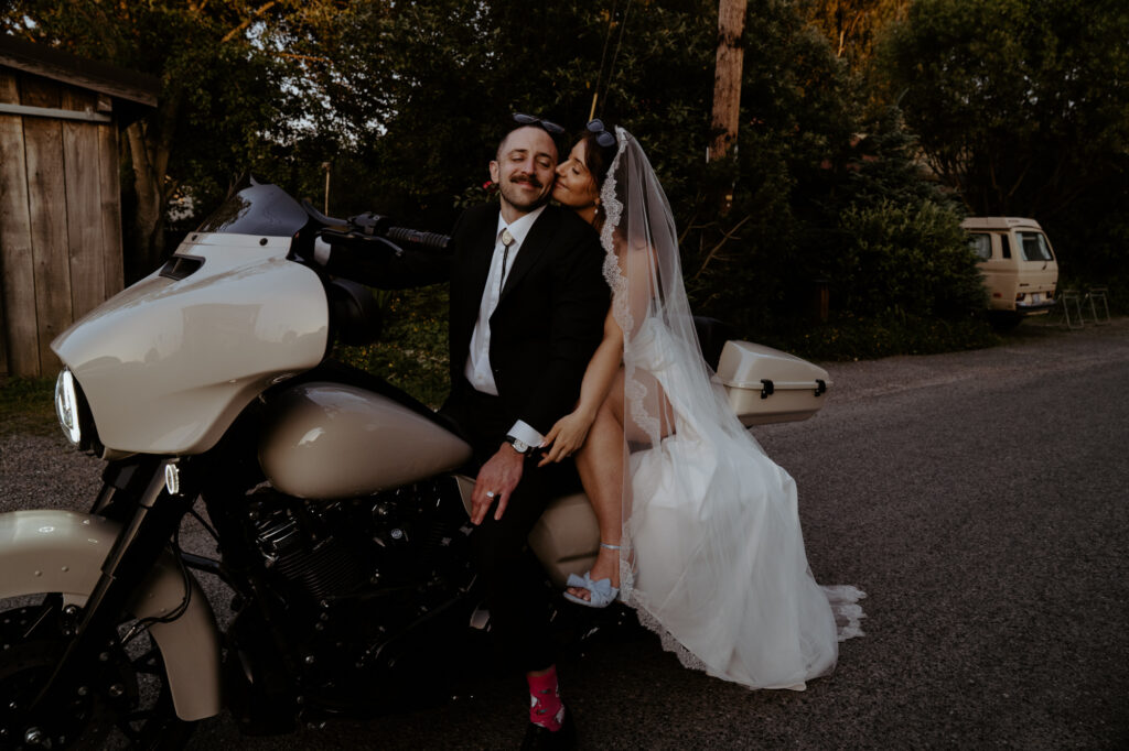 Groom kissing bride during portraits