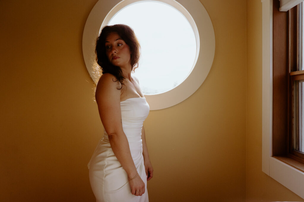 Bride getting ready at waterfront Airbnb in Bow Washington