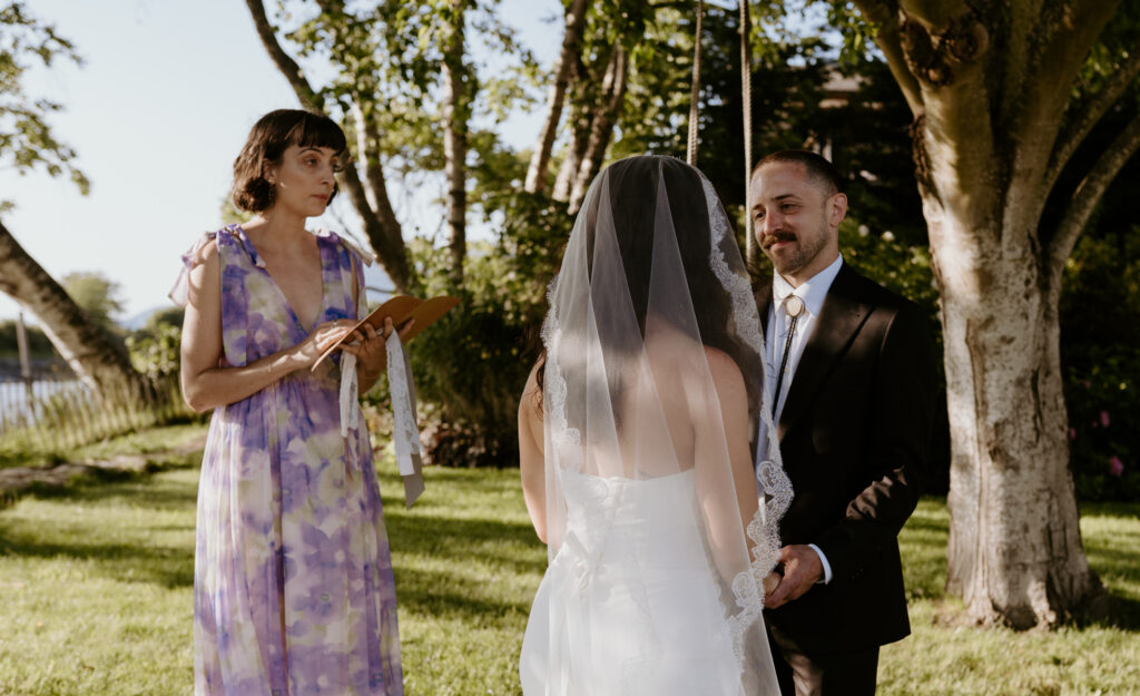 Bride holding bouquet during intimate micro wedding