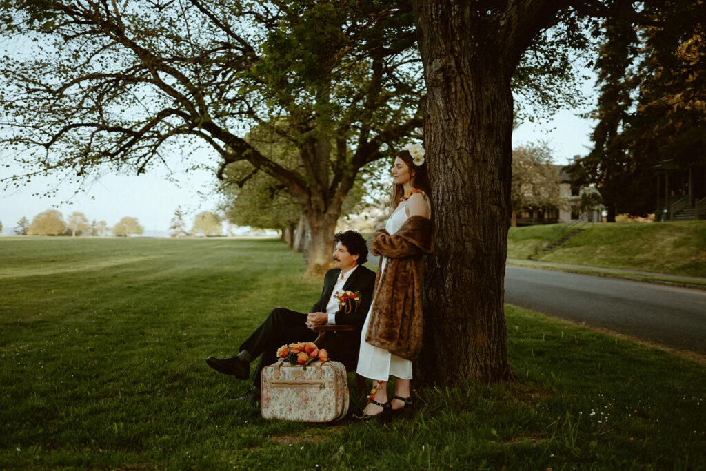 couple in vintage wedding attire with florals