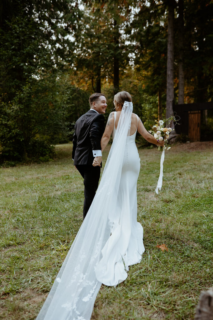 wedding couple smiles at each other after their wedding ceremony
